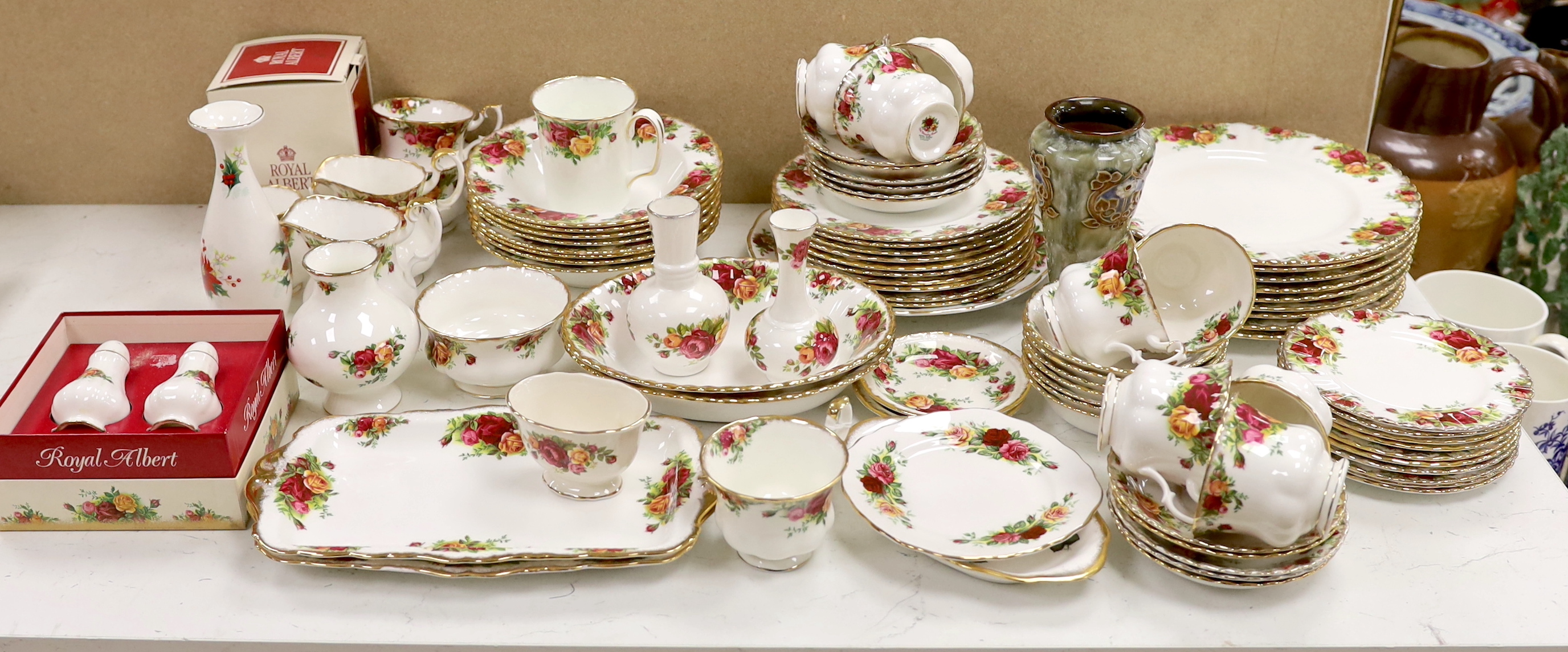 A Royal Albert Old Crown Roses dinner and tea service and a Doulton Lambeth vase